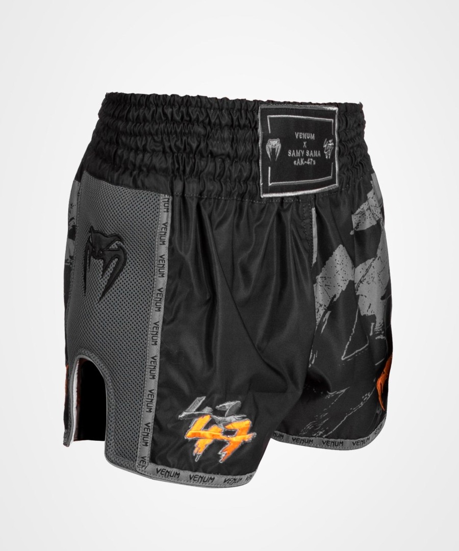 venum s47 muay thai short - zwartoranje